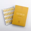 krabička vitamínu C a vedle ní položené platíčko s vitamínem C